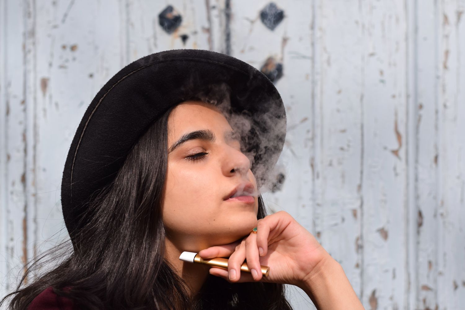 woman using e-cigarette
